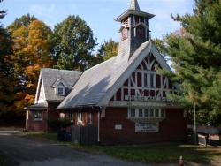 Photo of Grace Chapel surrounded by trees in Fall colors